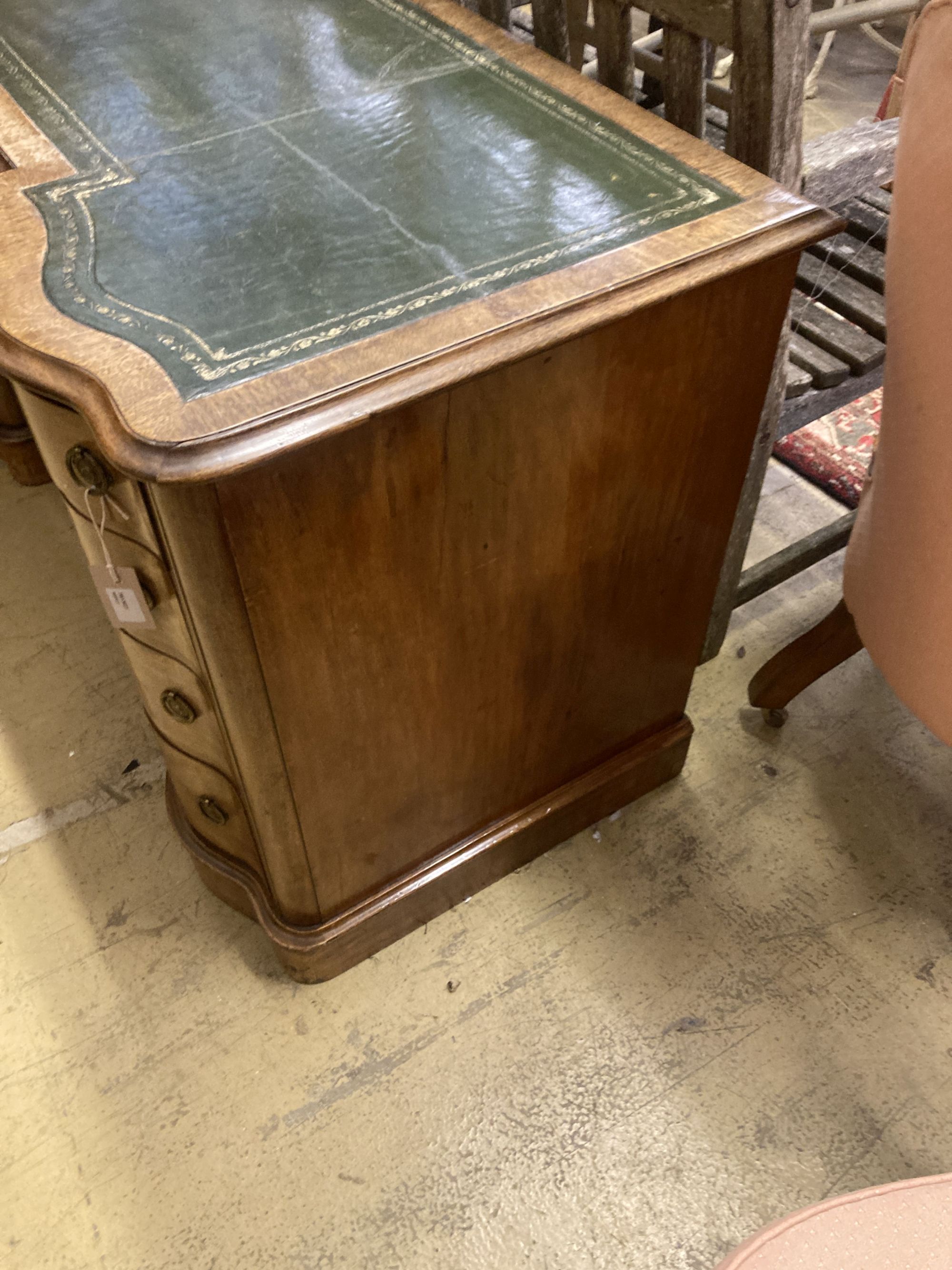 A Victorian style mahogany pedestal kneehole desk, width 138cm, depth 56cm, height 72cm